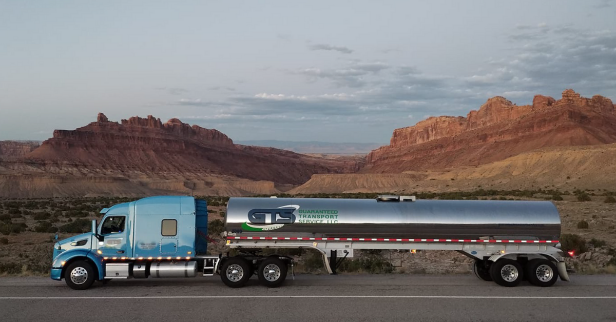 Tanker truck in front of mountains