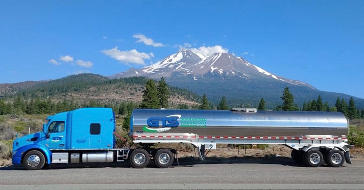 Tanker truck in front of mountains